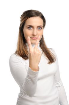 Young attractive girl shows gesture of the figure two. Isolated on white.