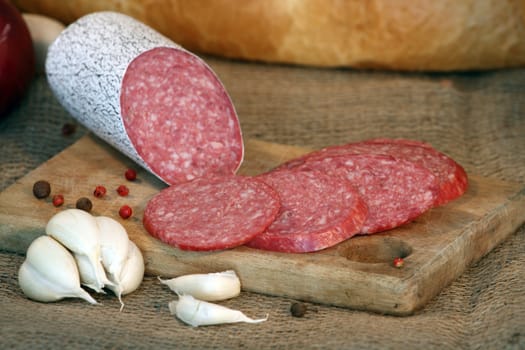 Close up of salami sausage on kitchen table 