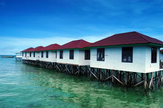 lined lodging buildings are made of wooden planks built over the sea on the beach