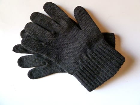 black woven gloves on a white background