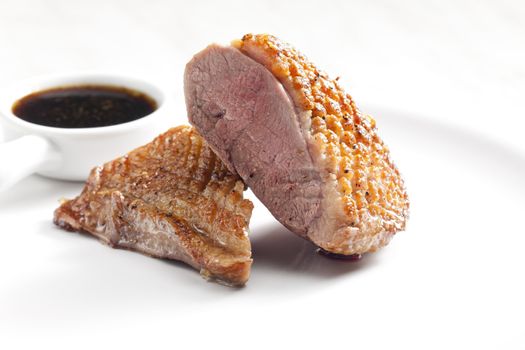 fried duck breast with sauce of honey, balsamico and red wine