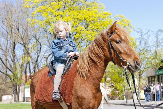 little girl on horseback