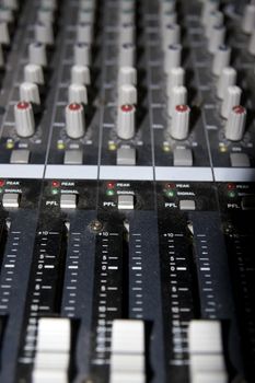 controls on a sound editing console