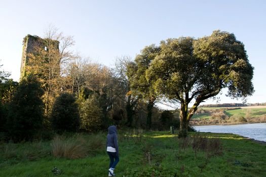 young girl exploring around Templemichael castle in county waterford ireland