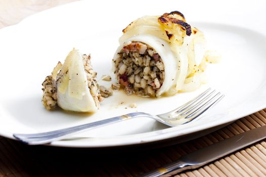 sepia filled with pearl barley baked with onion