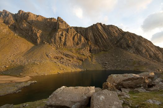 The buttresses of the mountain crags Clogwyn Du'r Arddu in the evening light, Snowdonia National park, Wales, UK.