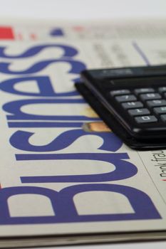 Business Newspaper and a calculator