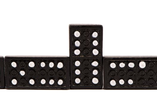 Sequence made of black domino parts on white background. Game toys.