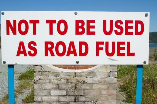 A white sign with the words 'not to be used as road fuel' written in red.