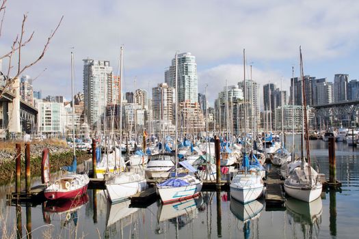 Yachts Moored by the Marina and Condominiums at Granville Island Bridge Vancouver BC Canada