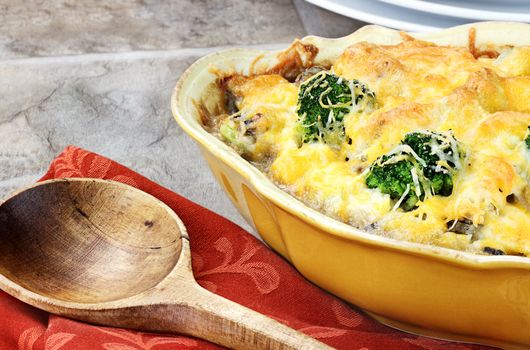 Cheesy broccoli casserole made with cheddar cheese, broccoli, portabella mushrooms and rice.