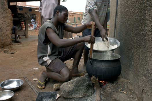 Bobo Dioulasso, Burkina Faso - February 19, 2005: boy in the prison kitchen.Prisons of living dangerously mixed adults association Terres des Hommes and transfers these specific rehabilitation center Laye
