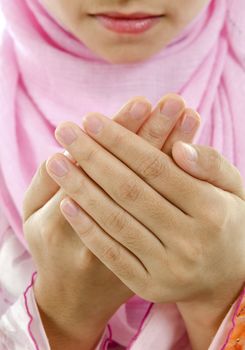 Muslim female cupped hand and praying