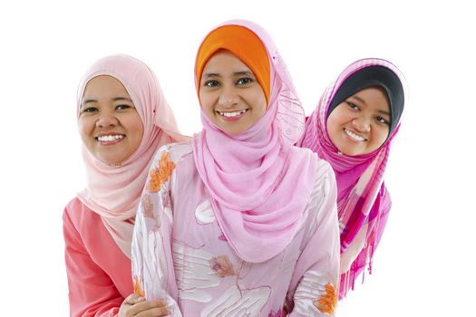 Happy Muslim women standing in row, on white background