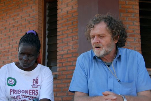 Balaka, Malawi, April 2007: a woman learns to make tailor  in recovery center  Half-Way House in Malawi, The missionary Piergiorgio Gamba has opened a shelter for those released from prison.