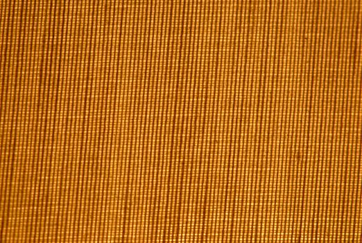 closup of a cross weave background lite from behind