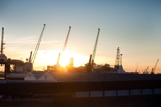 Loading cranes and warehouses at Cape Town harbor