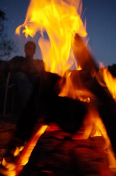 a nice campfire burning outside in summer