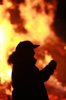 Close-up of some people coming out of fire