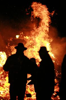 Close-up of some people coming out of fire