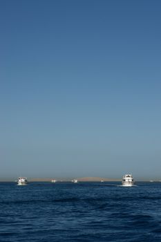 white boats on the read sea ocean