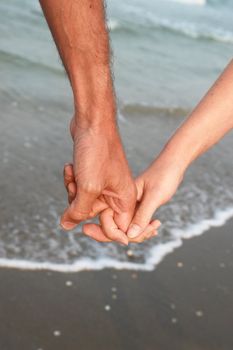 hands on the beach. on a nice day