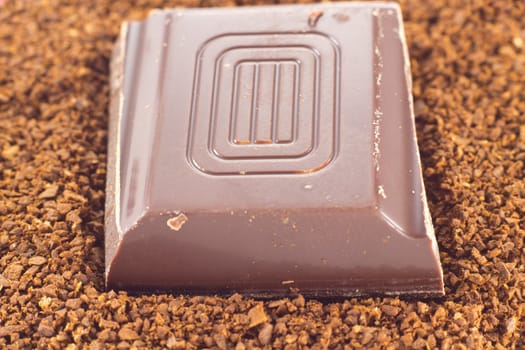 Picture of a chocolate piece on cofee powder