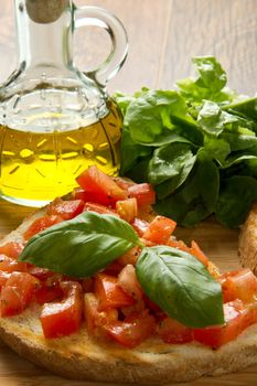 italian bruschetta with fresh tomatoes, basil, garlic, olive oil and cheese