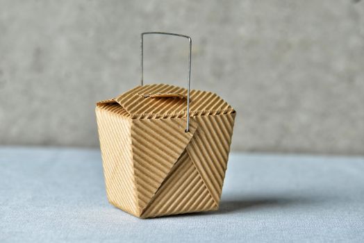 Image of a generic "to go" box made of recycled brown cardboard