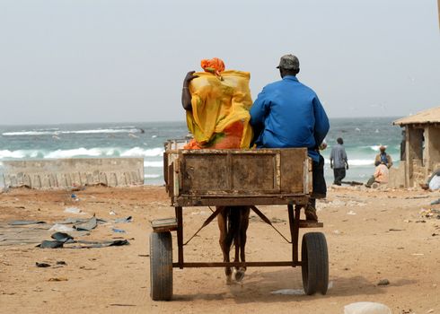 African couple on the wagon