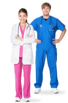 Medical doctors standing isolated. Young caucasian man or young asian woman doctor professionals or nurses in medical scrubs isolated on white background.