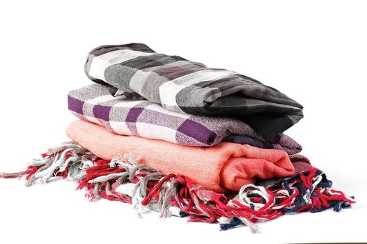Stack of checkered scarves isolated on white background