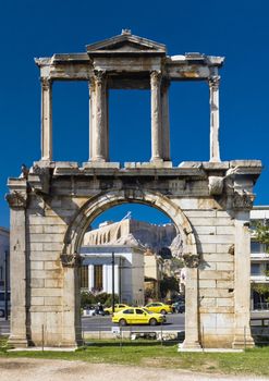 Hadrian's Arch in Athens, with the Acropolis seen in the background, Greece