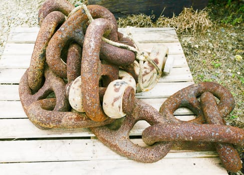 rusted chains at a boatyard.