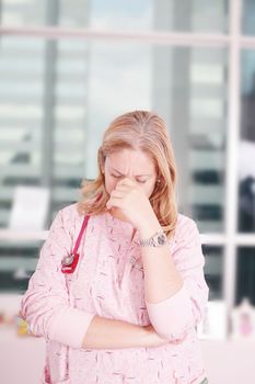 Overburdened doctor at the hospital in the stress