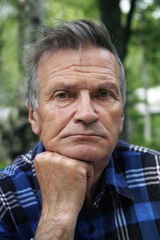 Senior man on a background of a forest