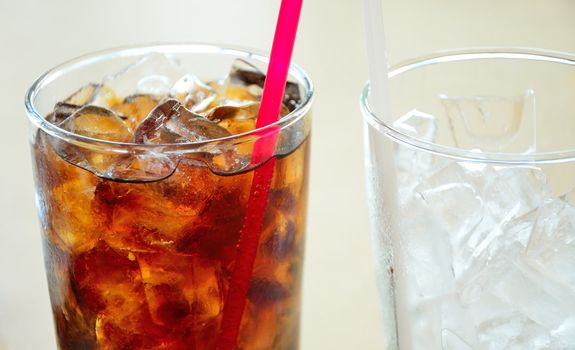 Soft drinks and ice in clear glass