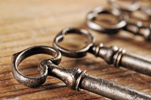 old keys on a wooden table, close-up