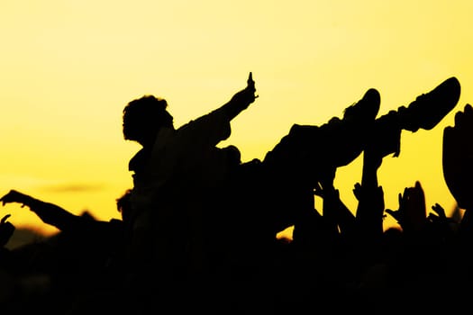 people celebrating on an open air shillouettes