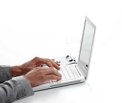 Businessman working at laptop computer, white background