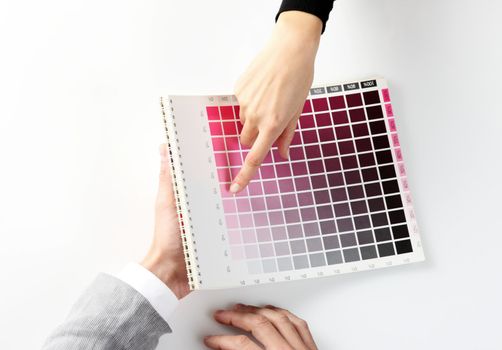 woman Choosing color from color scale, top view