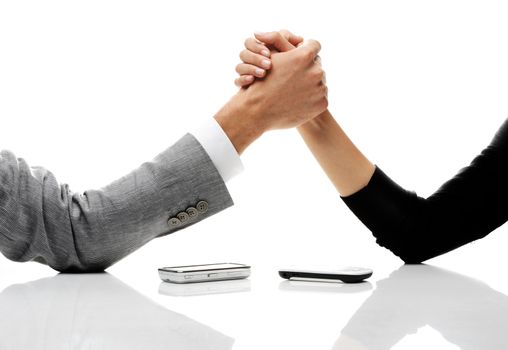 businessman and businesswoman arm wrestling on table. 