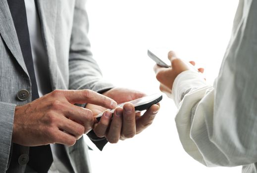 businesspeople text message on their mobile phones