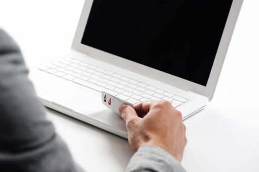 poker online, poker cards on white laptop - concept photo