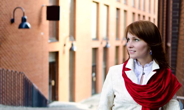 Portrait of pretty girl on the background of the city