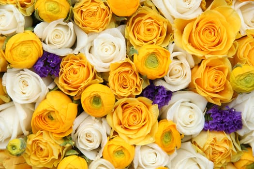 Wedding flowers in yellow and white with a touch of purple