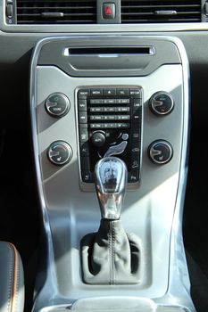 Dashboard and interior of a brand new car, leather and stainless steel