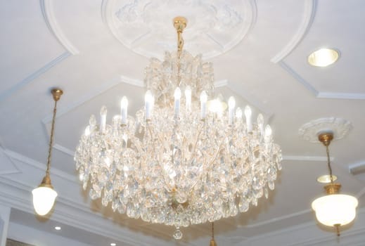 beautiful crystal chandelier hangs from the ceiling