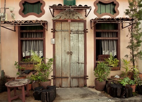 old wood door and window on wall of house