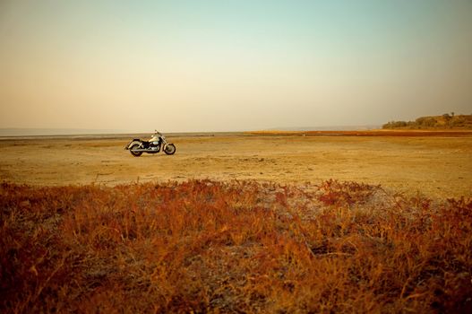 Dried-up salt lake at sunset at Kuyalnik lake